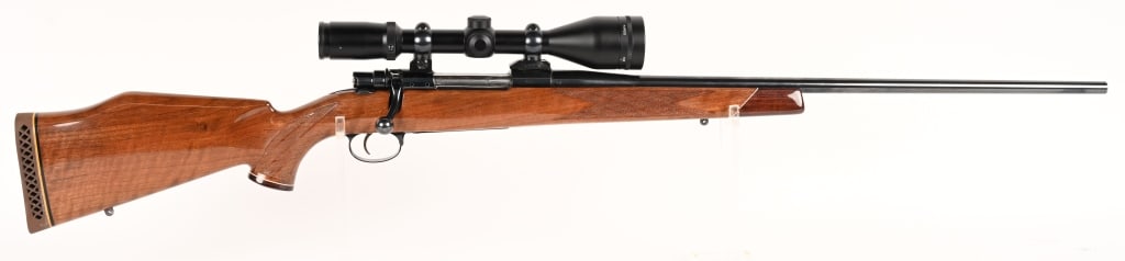 EARLY SOUTHGATE WEATHERBY MARK V IN 257 WBY MAG.: SERIAL NUMBER: 9338 BARREL: 24" CALIBER: 257 WBY MAG. MANUFACTURED: 1958 Metal is blue finish steel with polished bolt. Burris Full Field ll 4.5 - 14 x 42mm is mounted. Stock is select walnut with ski