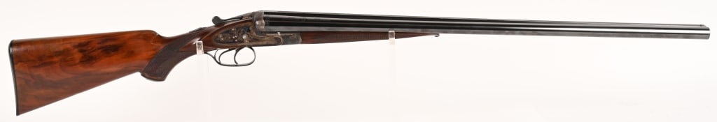 J. P. SAUER & SOHN 12 GAUGE SXS ENGRAVED SHOTGUN: SERIAL NUMBER: 391297. BARREL: 28". GAUGE: 12 GA. CHOKE: FULL (LEFT), MOD (RIGHT). CHAMBER: 2 3/4". MANUFACTURED: 1960 - 1970 This Sauer SxS shotgun features wonderful engraved caser-color receiver, f