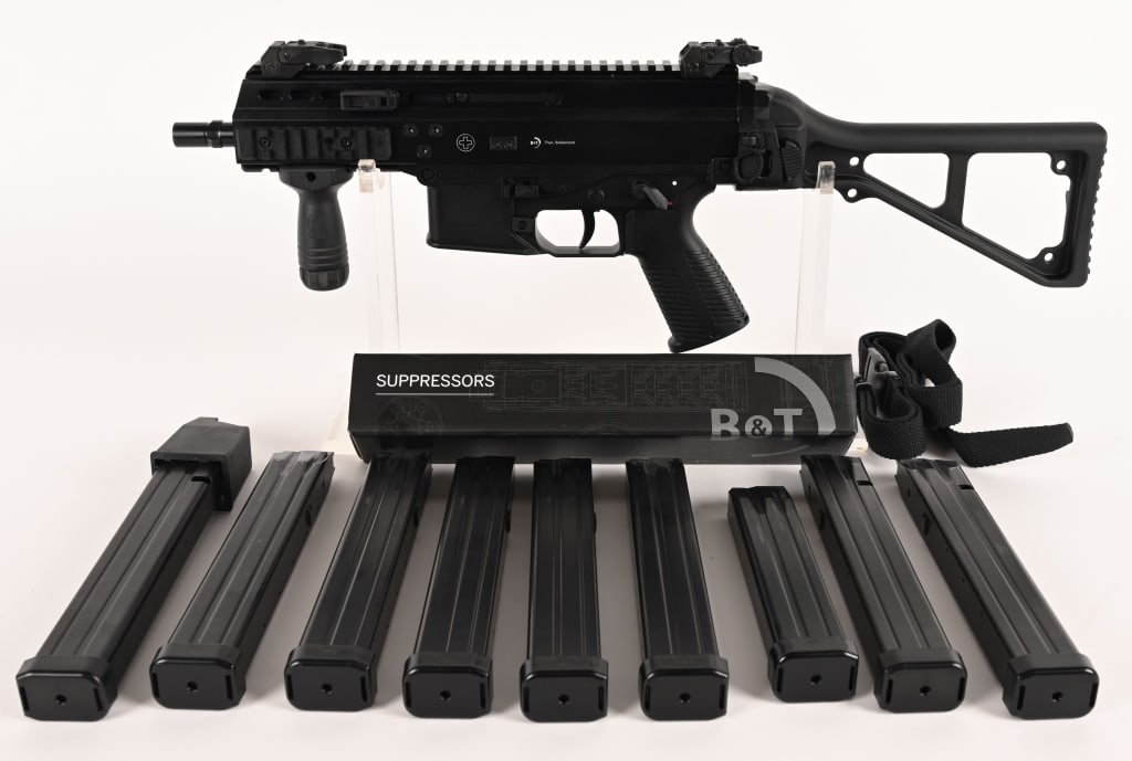 B&T APC 45 SHORT BARREL RIFLE WITH SUPPRESSOR: THIS IS A NFA CLASS III ITEM. SERIAL NUMBER: US 20-34563 BARREL: 7" CALIBER" 45 ACP. MANUFACTURED: 2020 Metal is Black parkerized finish with flip up sights. Polymer lower trigger group and side