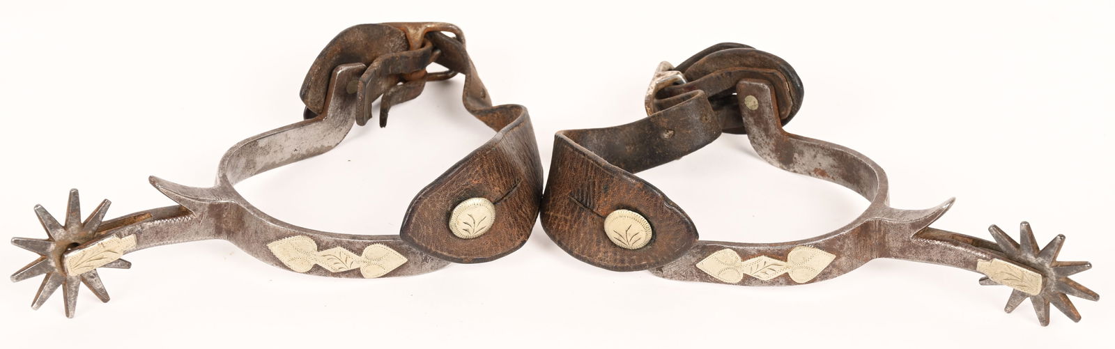 BUERMANN SPURS: Nice pair of single mounted spurs with chapgaurds and attractive 10 point rowels. Very Good-Excellent