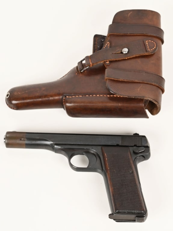 F N (BROWNING) MODEL 1922 NAZI PROOF WITH HOLSTER: SERIAL NUMBER: 4092C BARREL: 4 1/4" CALIBER: 7.65 MM MANUFACTURED: 1942 - 1944 WaA140 and Eagle over Swastika on left side of slide. Blue finished steel with V-notch and blade front sights. Checkered