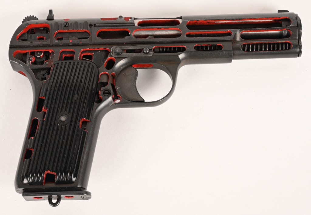 POLISH TT-33 TOKAREV CUTAWAY DATED 1953: SERIAL NUMBER: W0337. BARREL: 4-1/2". CALIBER: 7.62X25MM. MANUFACTURED: 1953. Factory cutaway, with no visible import marks found. Matching serials on the frame and slide. Standard blade front sight