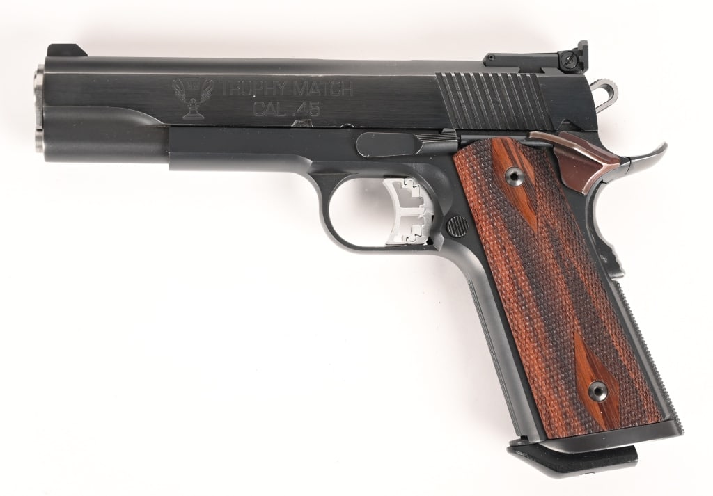 SPRINGFIELD TROPHY MATCH 1911 45 ACP: SERIAL NUMBER: NM148228 BARREL: 5” CALIBER: .45 ACP MANUFACTURED: 2000. This unique match-grade Springfield Armory Trophy Match is sure to delight its new owner. CONDITION: The gun remains in