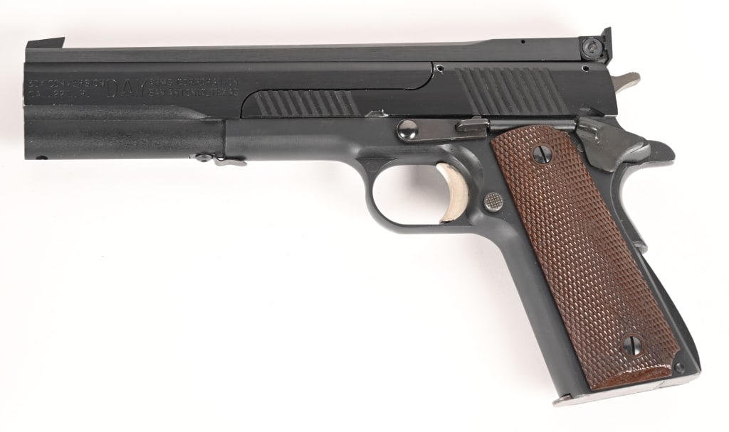DAY ARMS CORP .22 30X CONVERSION 1911: SERIAL NUMBER: BK-1 BARREL: 5” CALIBER: .22 LR MANUFACTURED: 2005. A nifty .22 caliber 1911 conversion platform built by the Day Arms Corporation. The gun is equipped with a 5" barrel, aluminum
