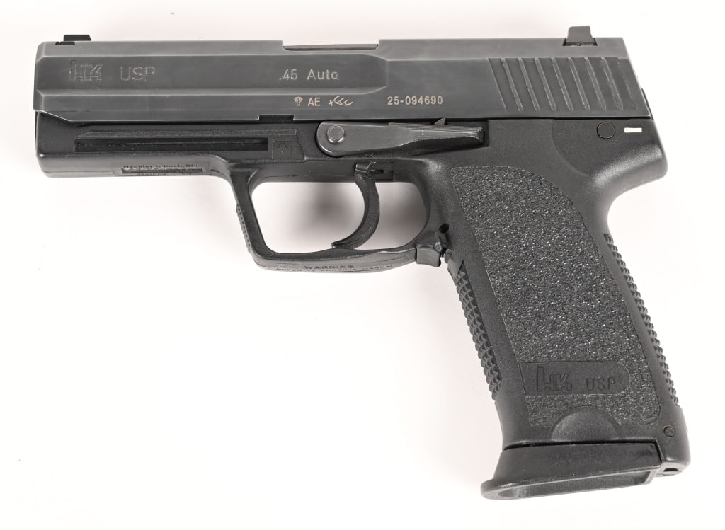 HECKLER & KOCH USP 45 H&K MFD 2004: SERIAL NUMBER: 25-094690 BARREL: 5” CALIBER: .45 ACP MANUFACTURED: 2004. Complete in a period correct H&K box with three magazines this fine USP .45 ACP is an excellent overall example.