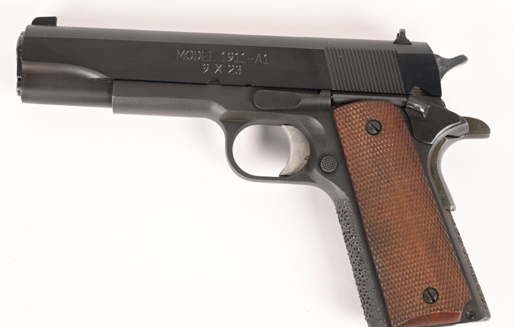 SPRINGFIELD ARMORY 1911-A1 9X23: SERIAL NUMBER: NM81409 BARREL: 5” CALIBER: .45 ACP MANUFACTURED: 2002. Springfield Armory 1911-A1 9x23 equipped with a 5" barrel, original blue finish and checkered walnut grips. The front strap