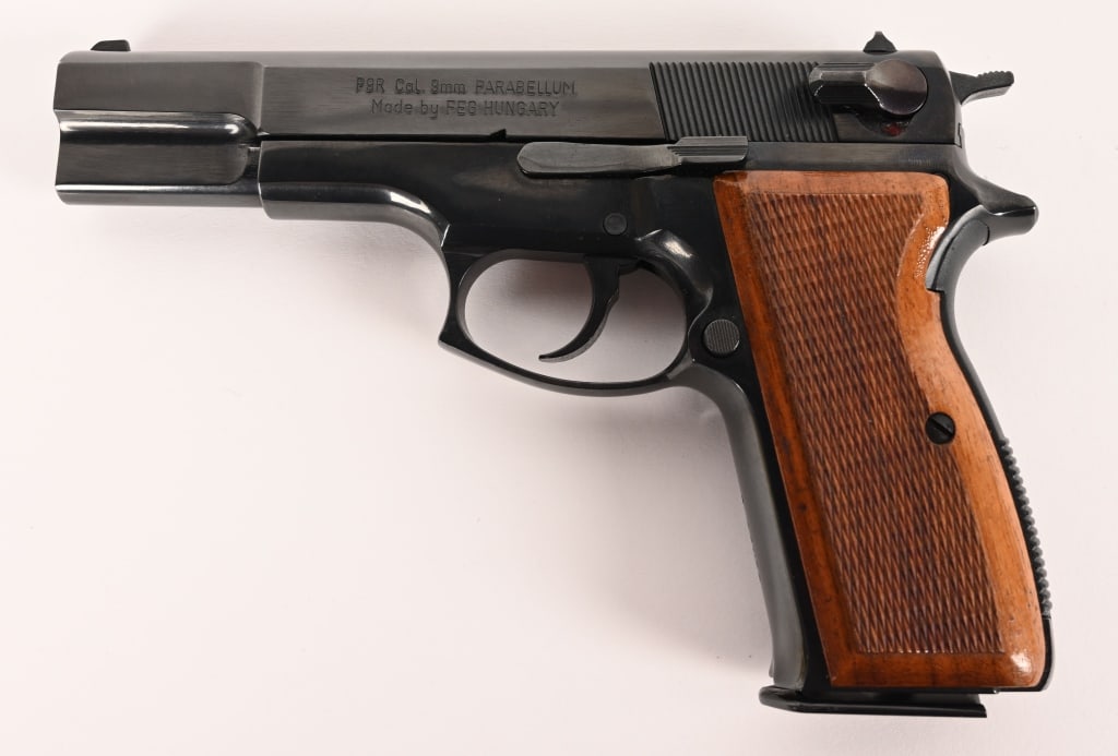 HUNGARIAN HI-POWER FEG P9R 9mm PISTOL: SERIAL NUMBER: R47064 BARREL: 4 5/8" CALIBER: 9 MM MANUFACTURED: 1990's Import marked. Blue finish with polish barrel and matching numbers. Hardwood checkered grips and one 13 round magazine.