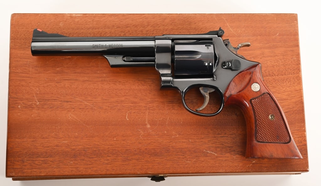 SMITH & WESSON MODEL 29-2 .44 MAGNUM: SERIAL NUMBER: N64975. BARREL: 6 ½". CALIBER: .44 Magnum. MANUFACTURED: 1970. Complete in the original mahogany display case with all the papers and tools this fantastic pinned and recessed Model