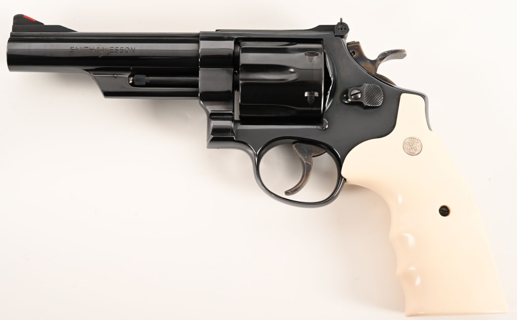 SMITH & WESSON MODEL 29-2 5" .44 MAGNUM: SERIAL NUMBER: N136827. BARREL: 5". CALIBER:.44 Magnum MANUFACTURED: 1973. Built in 1973 this pinned and recessed Model 29-2 is equipped with a sought after 5" barrel, original bright blue finish and