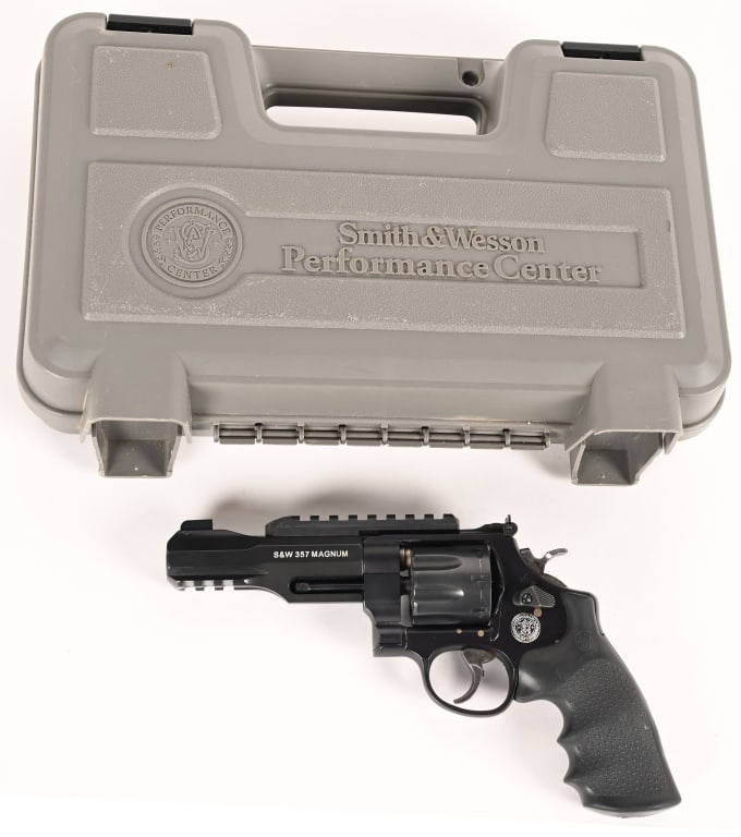 SMITH & WESSON MODEL 327 8-SHOT .357 MAGNUM: SERIAL NUMBER: CMX5209. BARREL: 4". CALIBER: .357 Magnum. MANUFACTURED: 2010. This interesting S&W 8-shot Model 327 comes in the original numbers matching grey hard case with the papers and
