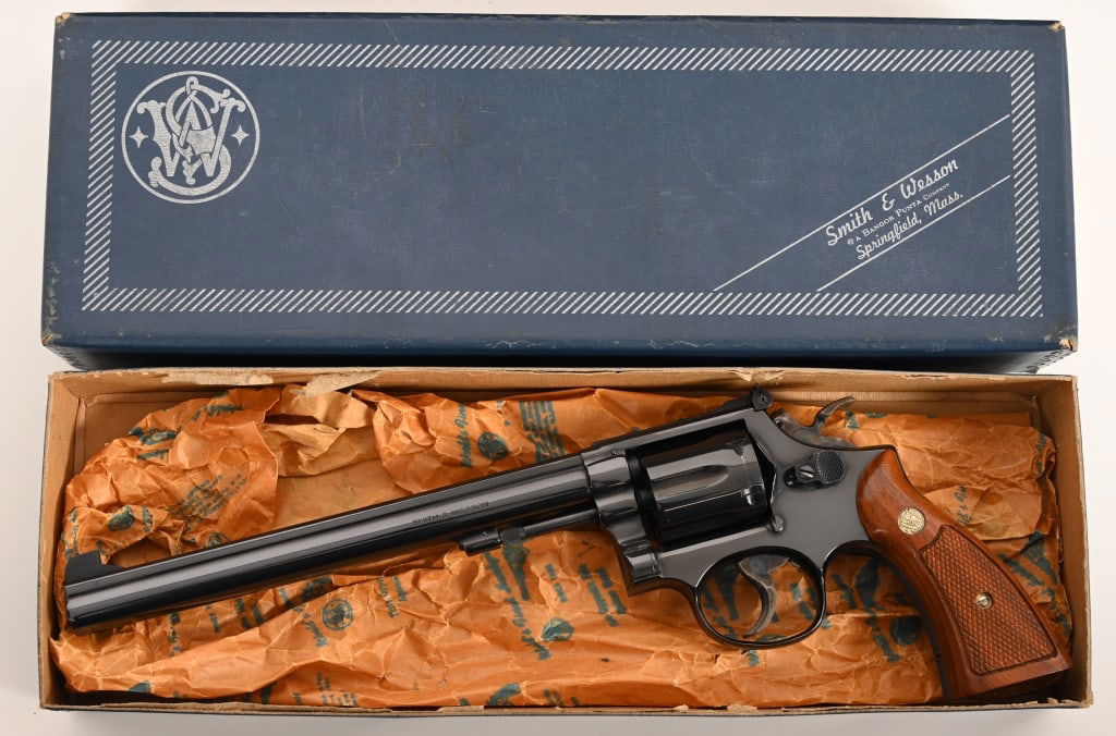 SMITH & WESSON MODEL 14-3 K38 BOXED LONG BARREL: SERIAL NUMBER: 3K45859. BARREL: 8 3/8". CALIBER: .38 Special. MANUFACTURED: 1971. complete in the original numbers matching two piece blue box with all the factory paperwork, unused sealed tool kit