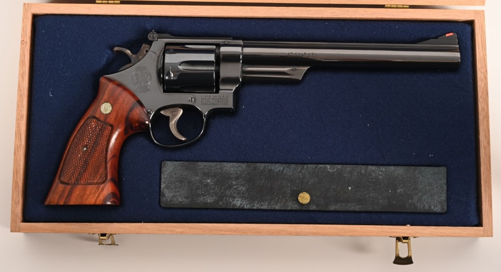 SMITH & WESSON MODEL 25 - 5 REVOLVER IN 45 COLT: SERIAL NUMBER: N677785 BARREL: 8 3/8" CALIBER: 45 COLT. MANUFACTURED: 1978 - 1980's Metal is deep blue high polish bluing with standard Red ramp front sight and a adjustable rear with white line at