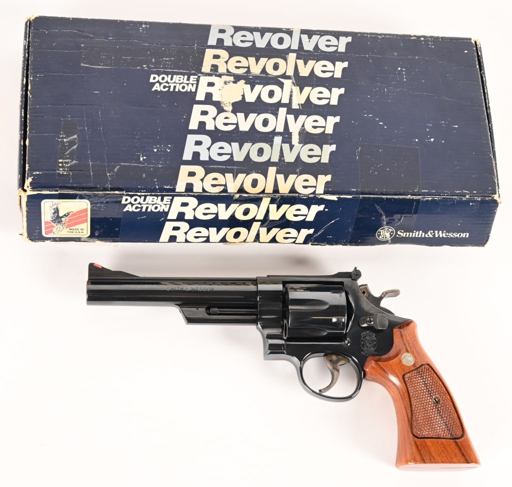 SMITH & WESSON MODEL 29-5 .44 MAGNUM: SERIAL NUMBER: BJC8142. BARREL: 6". CALIBER: .44 Magnum. MANUFACTURED: 1992. Complete in the original numbers matching one piece blue box with all the factory paperwork, this awesome Model 29-5 is