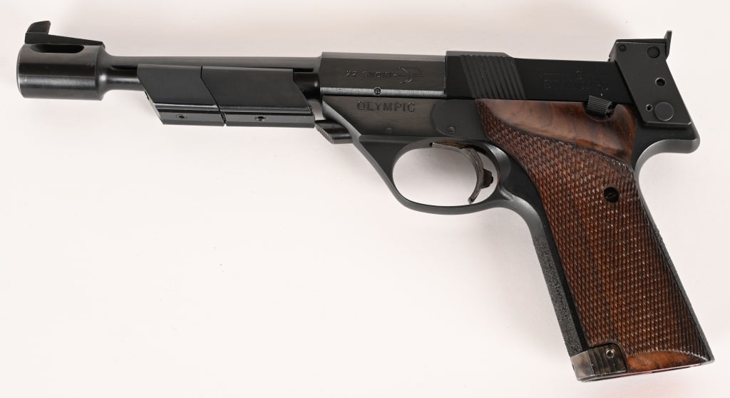 HIGH STANDARD OLYMPIC MODEL 106 SEMI AUTO PISTOL: SERIAL NUMBER: 1841892. BARREL: 6 3/4". CALIBER: .22 SHORT. MANUFACTURED: 1966. Model 106 Military features a factory compensator, weights and sights. Original blued finish and checkered wood grips