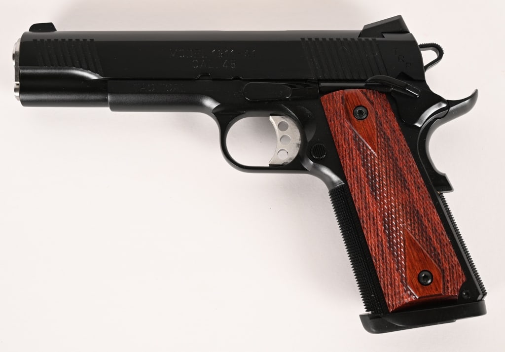 SPRINGFIELD ARMORY TRP TACTICAL SEMI AUTO PISTOL: SERIAL NUMBER: NM206700. BARREL: 5". CALIBER: .45 ACP. The Springfield Armory TRP Tactical Operator is a 1911-style semi-auto pistol chambered in .45 ACP, known for its reliability and stopping power.