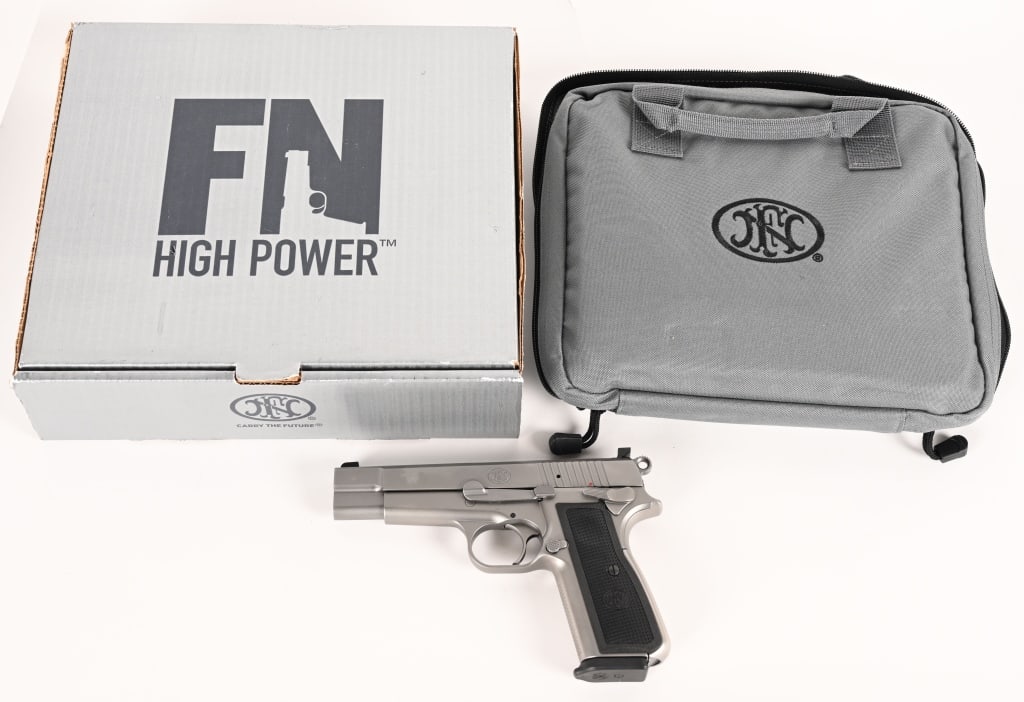 STAINLESS FN BROWNING HI POWER 9MM: SERIAL NUMBER: VM003507 BARREL: 5” CALIBER: 9MM MANUFACTURED: 2020. Built in 2020 this FN Hi Power is complete in the original numbers matching grey box with the soft rug, factory paperwork and