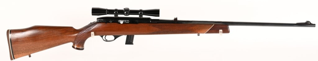 WEATHERBY MARK XXII SEMI AUTO RIFLE .22LR: SERIAL NUMBER: J-31521. BARREL: 24". CALIBER: .22LR. Made in Japan by KTG 1967-1971. Standard markings and features, including a single shot mode. Ramped blade front sight and two position flip rear.