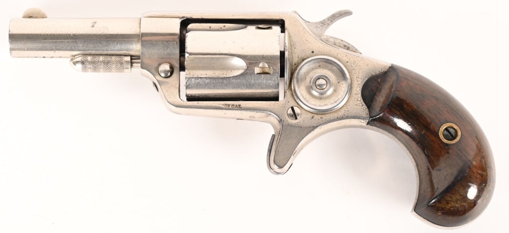 COLT NEW LINE .32 REVOLVER 1ST MODEL: SERIAL NUMBER: 5190, BARREL: 2 1/3" CALIBER: .32 MANUFACTURED: 1874 First model revolver with short flutes. Nickel plated with rosewood grips. Barrel marked "Colt's Pt. F. A. MFG. Co. Hartford, CT.