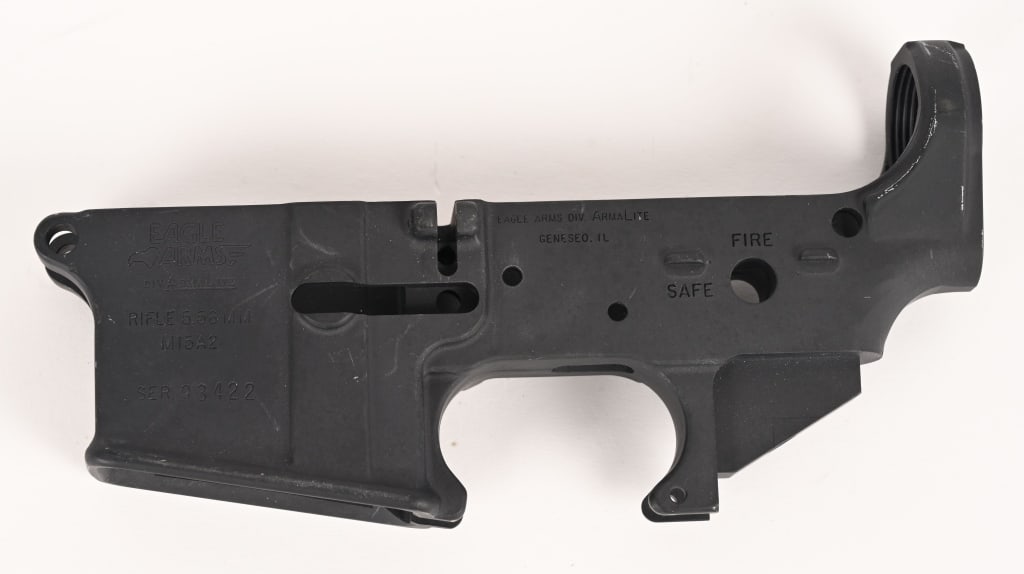 EAGLE ARMS BY ARMALITE AR15 LOWER RECEIVER: SERIAL NUMBER: 93422. This is a model M15A2 stripped AR15 lower receiver is in Good condition with some surface wear on the left side. Nothing that can't be fixed with a Birchwood Casey aluminum black