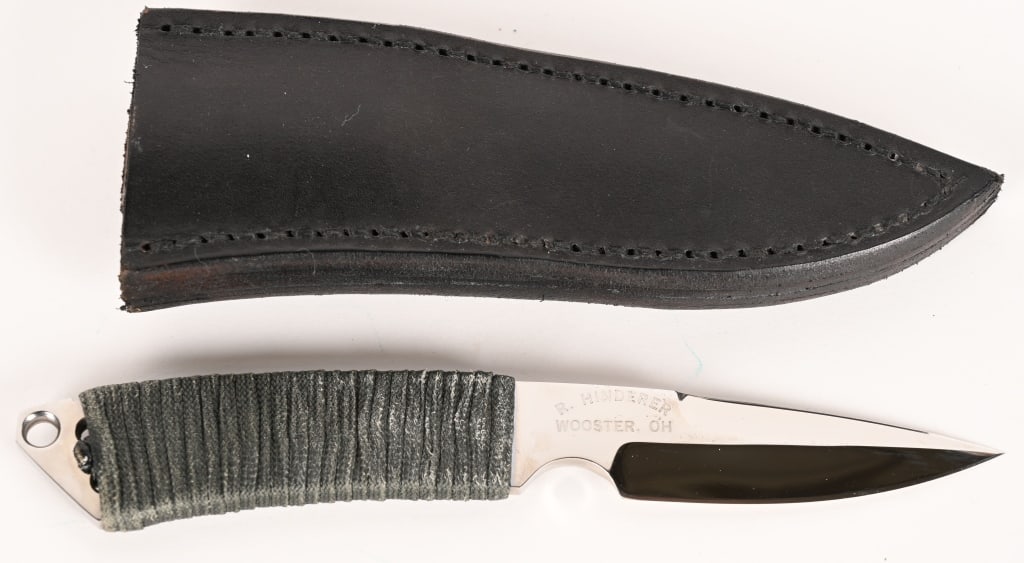 RICK HINDERER MADE SPEAR POINT KNIFE: BLADE: 3 1/8". OAL: 7 ¾". BLADE STOCK: 0.19". BLADE WIDTH: 0.91". This handmade knife is beautifully polished featuring an index finger groove, gray parachord wrapped handle and lanyard loop in