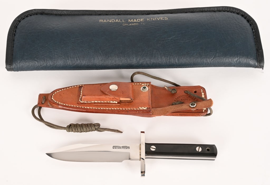 RANDALL MADE KNIFE MODEL 17 ASTRO: BLADE: 5 1/2". OAL: 10 1/4". Blade of 1/4" stainless steel stock. Large stainless steel hilt, silver-soldered. Approximately 4 3/8” black Micarta handle fastened with removable stainless steel
