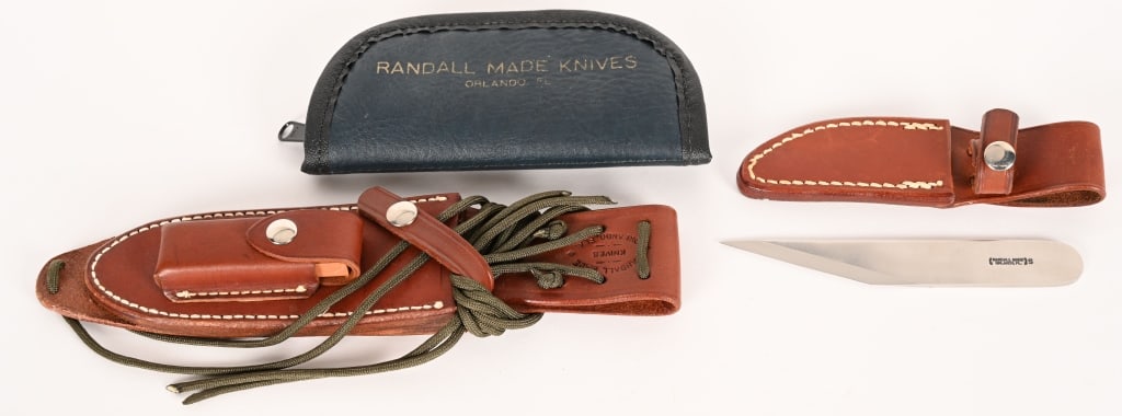 RANDALL MADE TAYLOR'S KNIFE & SPARE SHEATHS: BLADE: 3 1/4". OAL: 6 1/8". This is a stainless steel taylor's knife from Randall Made. Comes with soft factory case. (1) Small Randall Made sheath. 3 1/4" blade (est.) (1) Leather sheath and orange