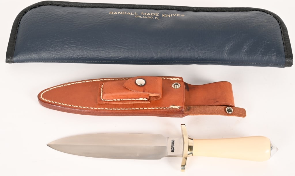 RANDALL MADE 7" DAGGER: BLADE: 7 3/8". OAL: 12 1/2". This custom monster features a dual edge 7 3/8" blade with nickel plate brass, micarta handle and skull cracker (conical) pommel. 1 5/8" blade width and 0.23 blade stock.