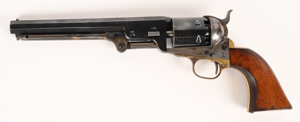 NAVY ARMS CO 1851 REVOLVER .36 CALIBER: SERIAL NUMBER: 1699. BARREL: 7 1/2". CALIBER: .36. This gun has no Italian proof marks and is not marked black powder only. The only marks are "NAVY ARMS CO" on the left side of the frame and on the