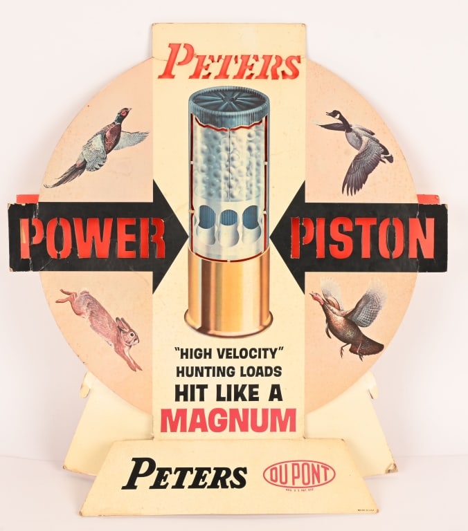 PETERS POWER PISTON MAGNUM SIGN: Original cardboard Peters Power Piston Magnum Sig. 2 Piece sign with nice image and colors. Shows some minor edge wear. Displays great. 21" Excellent
