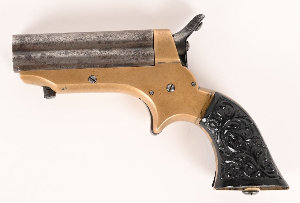 CIVIL WAR SHARPS 4 BARREL DERINGER: SERIAL NUMBER 4492 BARREL 2 1/2" CALIBER .22 RIMFIRE MANUFACTURED CIRCA 1865. Four Barrel with brass frame and 2 piece smooth gutta percha grips. Serial numbered on butt of frame and underside of