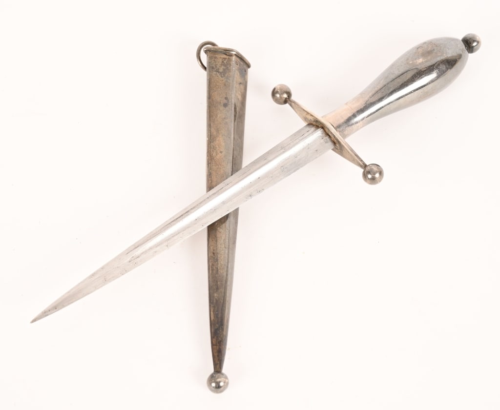 BRITISH SILVER MOUNTED DIRK OR DAGGER 19TH CENTURY: Early Silver Mounted British Dirk measuring 9 1/2 inches overall with a 5 3/4 inch, double fullered blade. The blade appears to be from the 19th Century. Excellent.