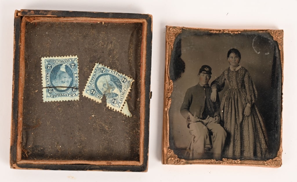 CIVIL WAR 1/6 RUBY AMBROTYPE SOLDIER & WIFE: Civil War 1/6 plate ruby ambrotype os a seated soldier with his wife leaning on his shoulder. The image has good contrast and clarity. The soldier is wearing a regulation sack coat and kepi, Curiously