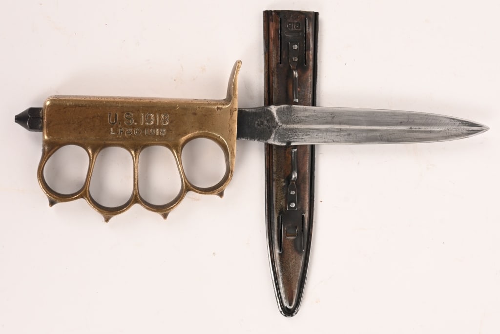 WWI US M1918 TRENCH KNIFE, LF&C W/ SCABBARD WW1: A modified, Model 1918 "Knuckle Duster" Trench knife with solid brass handle made by Landers, Frary, and Clark and so marked "L. F. & C." on the handle and on the scabbard. Features spiked knuckle gua