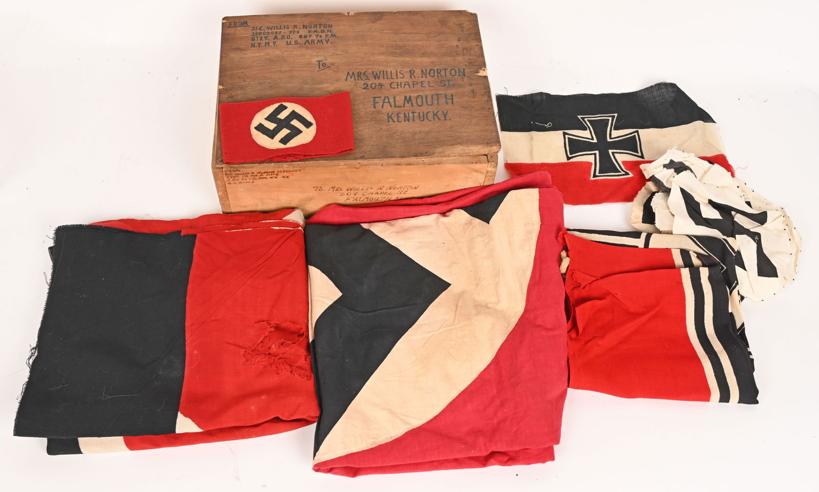 WWII NAZI GERMAN BRING HOME BOX W FLAGS KRIEGS KM: Bring back box full of souvenirs just as it was packed in 1945. The souvenirs were brought back by PFC. Willis R. Norton ASN 35802037 of the 775th Field Artillery Battalion. The lidded wood box measur