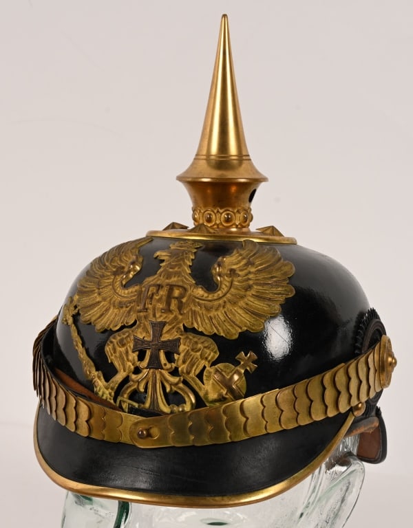 WWI GERMAN PRUSSIAN OFFICER'S PICKELHAUBE W COVER: Very pristine Prussian reserve officer’s spiked helmet. Fantastic body and front and back visors with virtually no crazing. Cockades, chin scales and helmet plate all are original to the helmet.