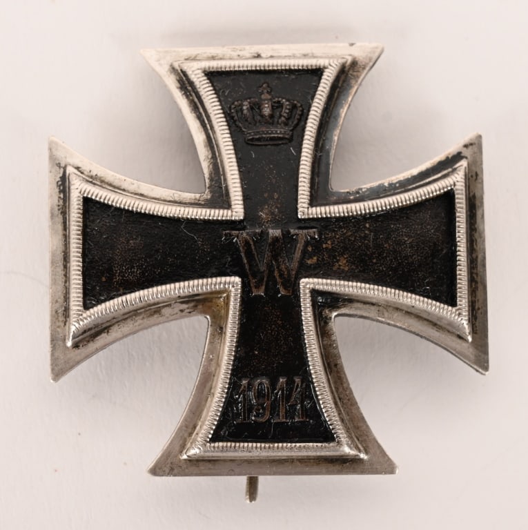 WW1 IMPERIAL GERMAN 1ST CLASS IRON CROSS WWI: IRON CROSS 1ST CLASS, 1914. 1914 pattern, die struck, three piece, iron and alloy construction Pattée style cross with a single piece iron core and a two piece silver alloy frame. The obverse of