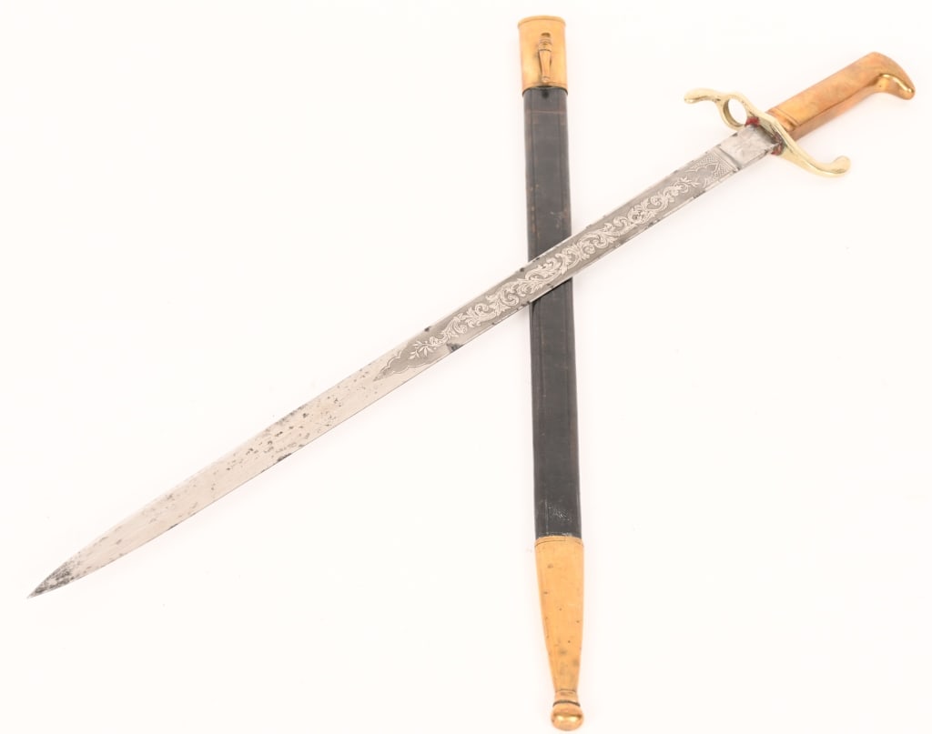 GERMAN M1871 MAUSER RIFLE DRESS SWORD BAYONET: This bayonet is in excellent original condition. Fine etched décor on both sides with the text Mitt Gott Fur Kaiser u. Reich. Fine brass hilt. In its fine original brass mounted leather scabbard