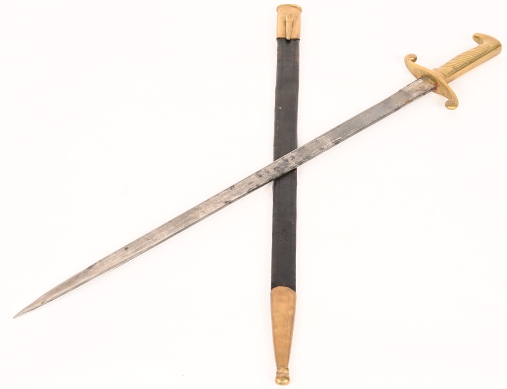 GERMAN MAUSER M1871 DRESS BAYONET W UNIT MARK: In fine to excellent original condition. Fine blade with faint etched panels on both sides. In its fine original brass mounted leather scabbard with all solid stitching. Matching unit markings on cros
