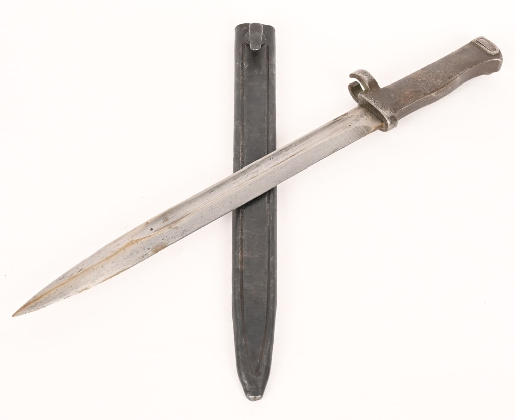 WWI IMPERIAL GERMAN MAUSER RIFLE ERSATZ BAYONET: In very good original condition. Very good plus blade with a fine inspector stamp on spine. Very good grip with functional push button release. In its very good original 3305 marked grip showing norma