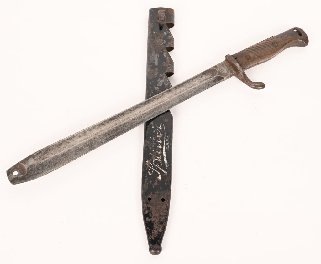 WWI GERMAN SPLITTER CONVERTED BAYONET W SCABBARD: In very good general condition. Absolutely authentic. Very good blade with very good ricasso and spine markings. 1917 dated. Very good original wood grips. Removed push button release. In its very goo