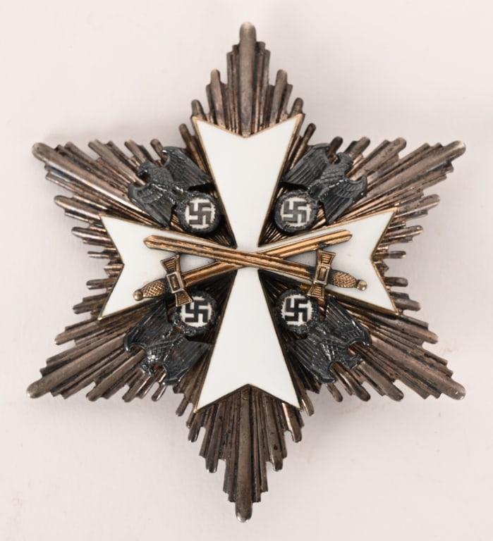 WWII NAZI GERMAN EAGLE ORDER BREAST STAR WW2: A beautiful and quite scarce German Eagle Order Breast Star with Swords by Godet. Made out of a base of “900” silver, the award is in overall near mint condition. The silver star exhibits
