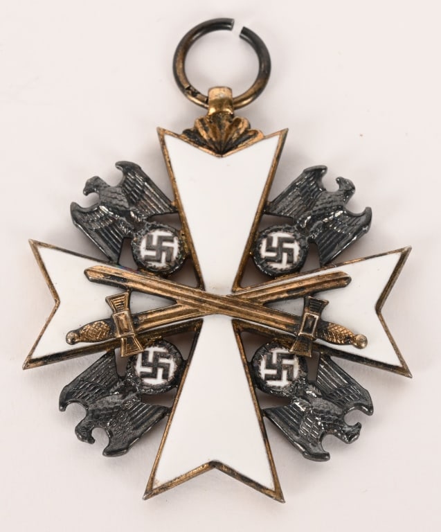 WWII NAZI GERMAN EAGLE 5TH CLASS WITH SWORDS WW2: 1943 pattern, die struck, 5th class award, with white enamel work and fired gilt finish. Award in the form of a 45mm square, Maltese cross with white enamel arms. A gilt eagle with down swept wings, c