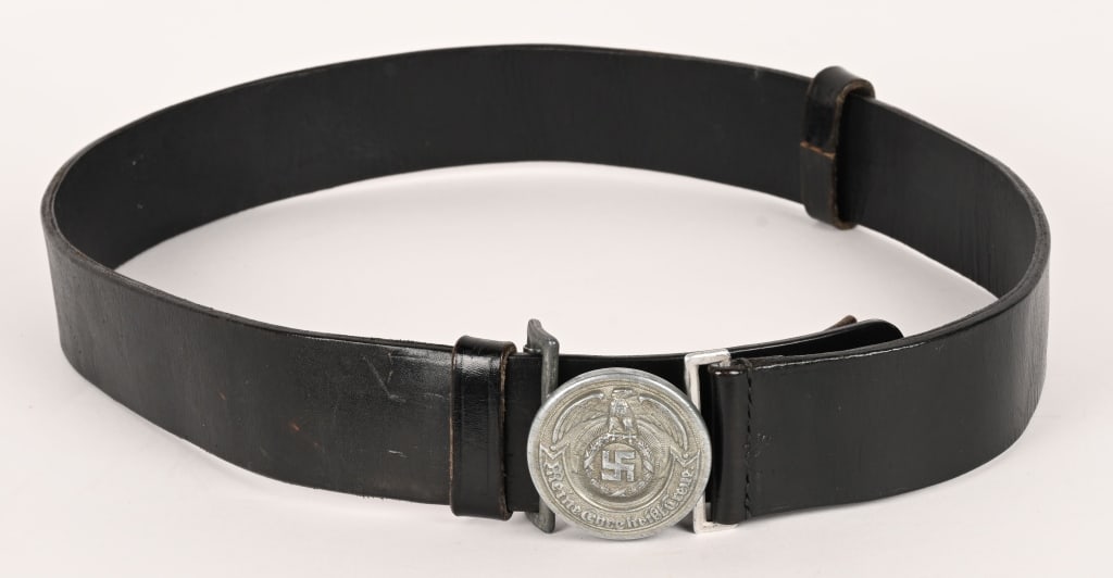 WWII NAZI SS OFFICER'S LEATHER BELT & BELT BUCKLE: Silver washed, die struck, aluminum alloy construction, circular belt buckle features a high relief, stylized, national eagle with outstretched, downward curving, wings, clutching an oak-leaf wreath w