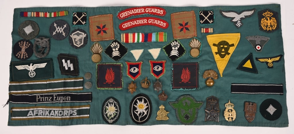 WWII PATCH BLANKET W NAZI CUFFTITLES SS INSIGNIA: a absolutely fabulous Patch Blanket with Nazi German, Great Britain and Italian Insignia applied to a green cotton fabric measuring 28 X 12 inches with an unfinished SS Runic Collar Tab, Pri