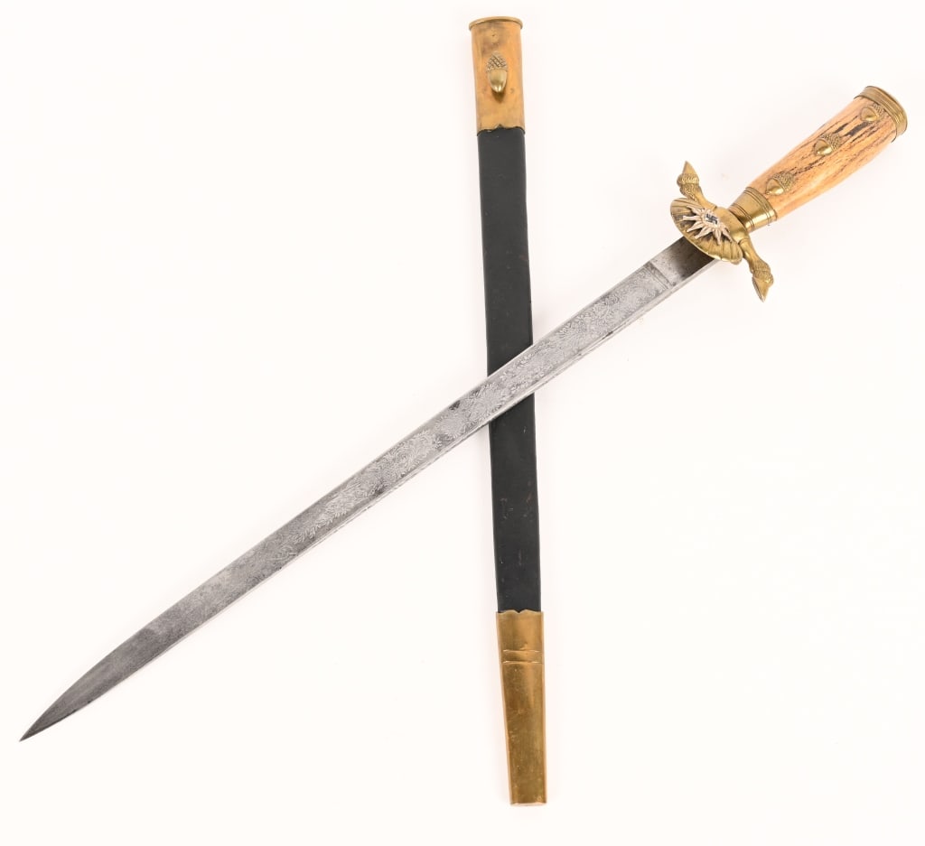 WWII NAZI SA GRUPPE HOCHLAND HIRSCHFÄNGER WW2: WWII Hirschfänger is a very large example measuring about 21 1/4 inches overall. It has standard brass hilt mounts featuring the lined edges of the pommel with umbrella-like engravings. The ferru