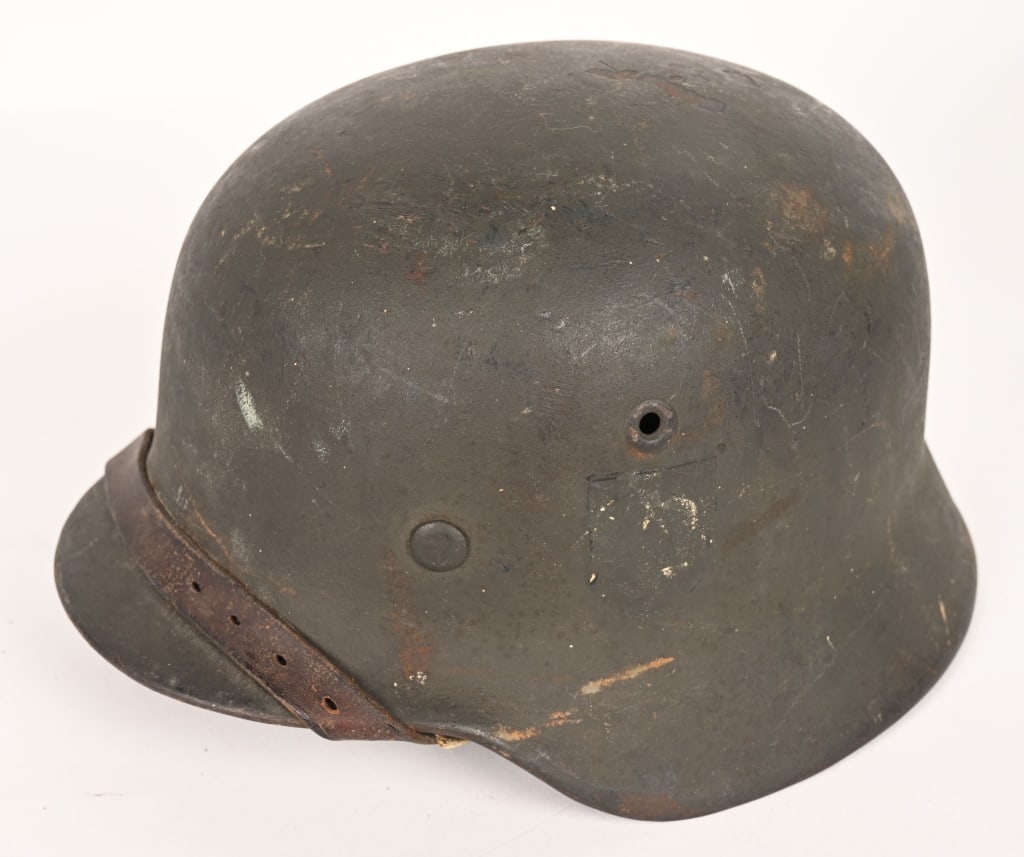 WWII NAZI GERMAN M40 SD COMBAT HELMET NS68 WW2: The stamped, sheet steel construction helmet retains about 85% of its field-gray paint. The left side of the helmet has a Wehrmacht eagle shield decal which is retained about 10%. All three liner reta