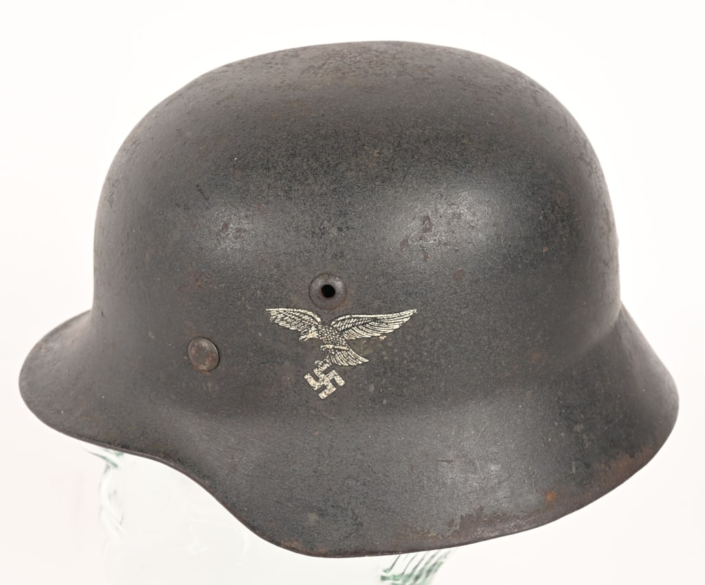 WWII NAZI GERMAN M35 DOUBLE DECAL HELMET Q62 WW2: The stamped, sheet steel construction factory M35 helmet retains a good portion of its slightly rough textured, Luftwaffe blue/gray paint. The left side of the helmet has a first pattern Luftwaffe