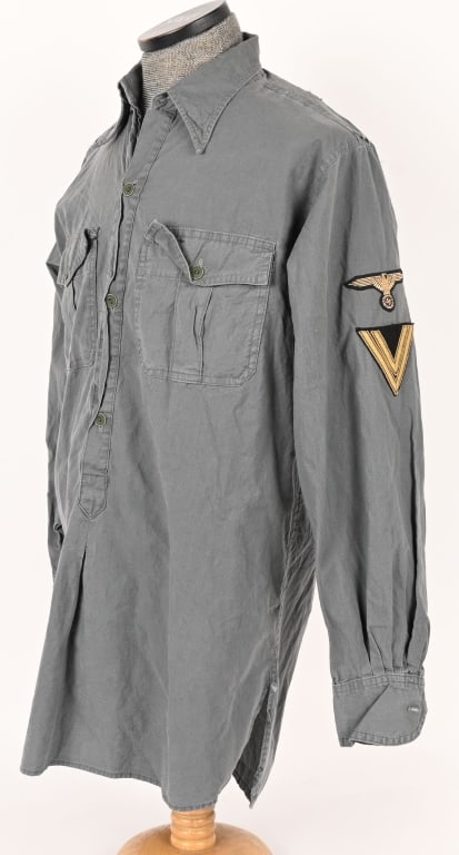 WWII NAZI GERMAN WAFFEN SS TROPICAL SHIRT W EAGLE: M41, green/blue cotton, pleated pockets. All original buttons and stitching. There are no longer any visible markings that I could find, they are most probably there but now obscured by age or wear. T