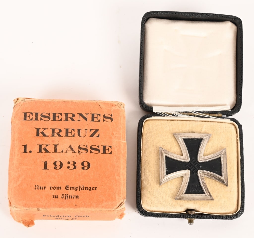WWII NAZI GERMAN 1ST CLASS IRON CROSS W CARTON: 1939 pattern, die struck, three piece, iron and nickel/silver plated alloy construction Pattée style cross with a single piece iron core and a two piece alloy frame. The obverse of the award