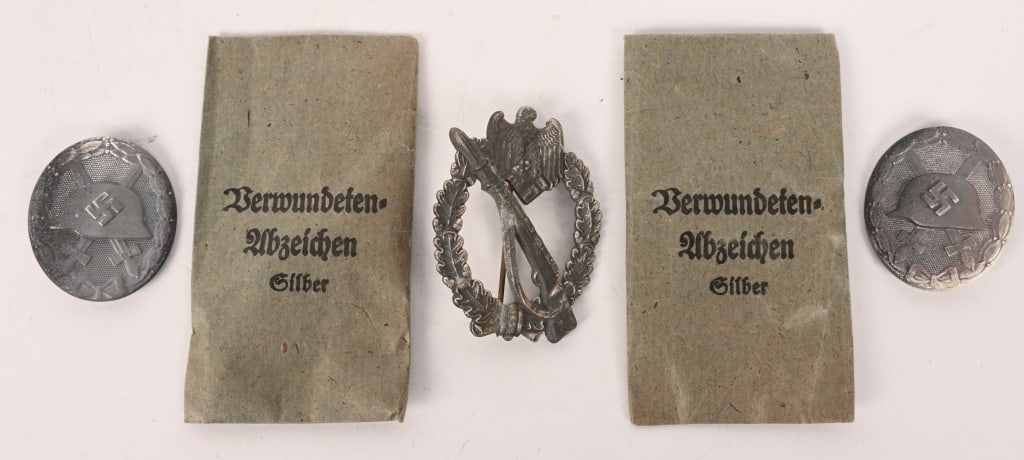 WWII NAZI GERMAN MEDAL LOT INFANTRY & WOUND BADGE: Lot of WWII Nazi German Medals to include 1) INFANTRY ASSAULT BADGE IN SILVER. Die struck alloy award with silver wash. The nicely detailed badge features an embossed, vertically oval, oak-leaf